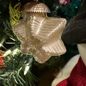 This is a vintage Kugel glass star Christmas ornament. Mini
